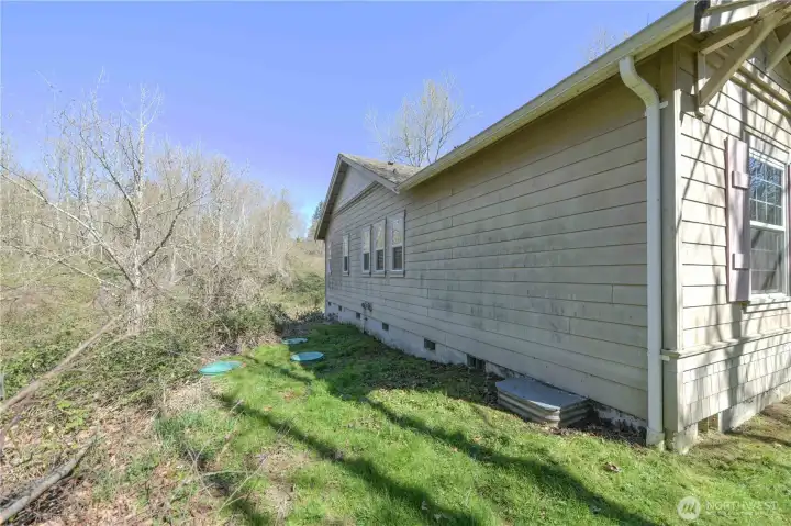 Side of house with septic risers