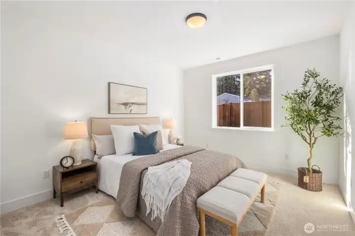 Main-Level Guest Bedroom:  Generous natural light fills this main-level bedroom, highlighting the fresh neutral palette and soft carpeting that creates a comfortable retreat. Its location just steps from the main-floor bath supports flexible living arrangements, offering privacy and accessibility for many lifestyle needs. Nestled within Bothell’s Canyon Park area, the home places you near local recreation, Northshore schools, and easy commute options along I-405. This room adds valuable versatility to the floorplan, enhancing both daily convenience and guest comfort.    These photos are from Lot 5 at Gooden Hollow, the community model. The home listed will have changes, so all photos, renderings, site maps, and floorplans are for visualization purposes only. Plans, colors, building orientation, finishes, home outlook, and other details can and WILL vary.