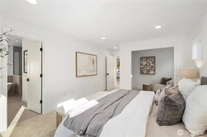 Primary Suite – Expanded View:  This wider perspective highlights the suite’s spacious layout, recessed lighting, and direct connection to the spa-inspired bath and attached sitting room. Its thoughtful floorplan promotes easy flow between rest, dressing, and relaxation areas. Being part of the Canyon Park community in Bothell means the suite sits moments from everyday conveniences, Northshore schools, and outdoor recreation. The overall scale invites a sense of calm and allows you to shape the space to match your preferred style of retreat.    These photos are from Lot 5 at Gooden Hollow, the community model. The home listed will have changes, so all photos, renderings, site maps, and floorplans are for visualization purposes only. Plans, colors, building orientation, finishes, home outlook, and other details can and WILL vary.