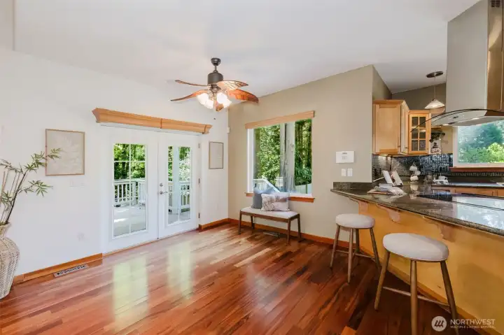 Kitchen with breakfast nook and french doors to the glorious deck