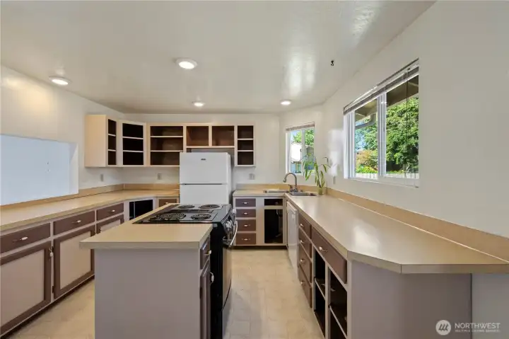 Actual photos of kitchen without cabinet doors (they are currently stored in the garage).