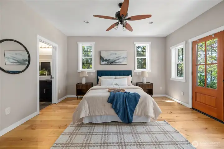 The primary suite is a home unto itself. French doors out toward the water and full ensuite bath with steam shower. The primary suite is a home unto itself. French doors out toward the water and full ensuite bath with steam shower.