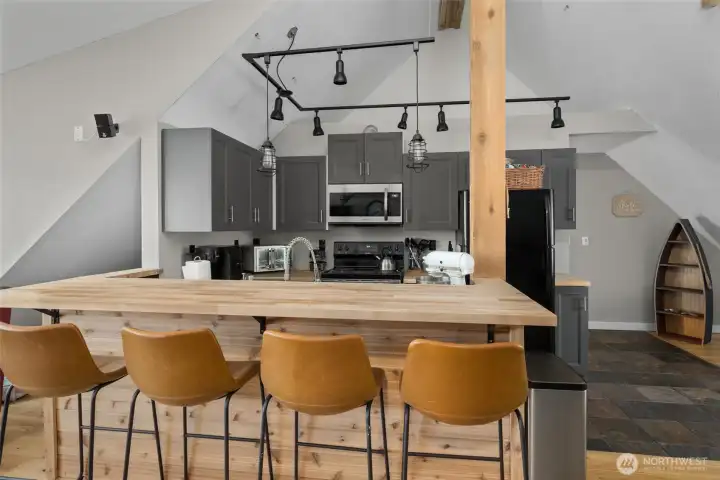 A full kitchen greets you at the top of the stairs. A full kitchen greets you at the top of the stairs.