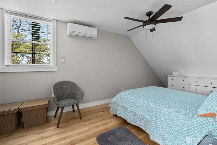 The main bedroom has a large closet and views toward the water. The main bedroom has a large closet and views toward the water.