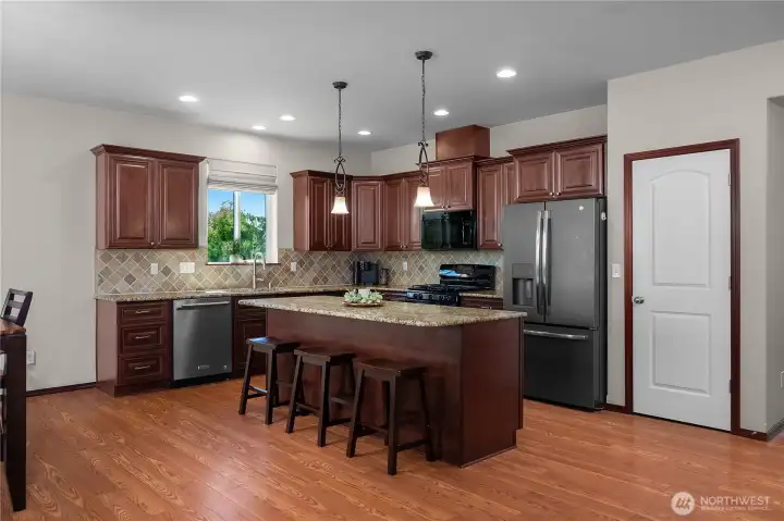 Granite Countertops, plenty of storage, soft close cabinets, and pull out shelving. Offers not 1, but 2 pantry's!
