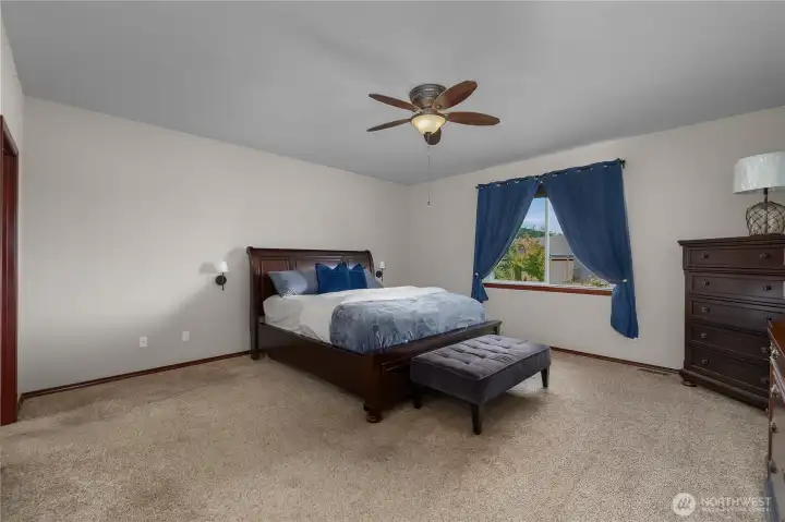 Enjoy your own private retreat in your generously sized primary suite featuring French doors. Fall asleep to the tranquil sound of the waterfall flowing into pond.