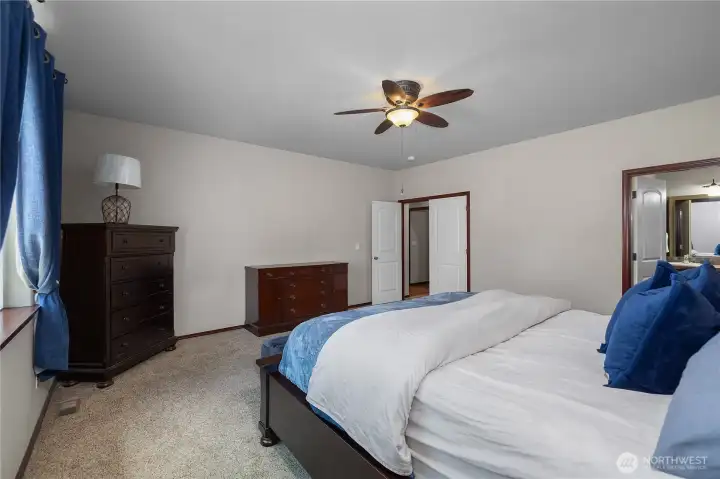 Primary suite sits off the back of the house from the hallway off the living room.
