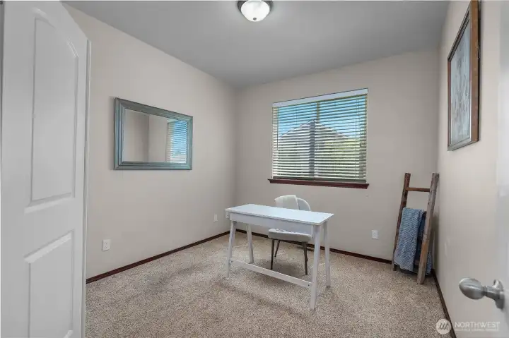 Bedroom 3 features French doors. Makes for a great bedroom, office, den or workout room.