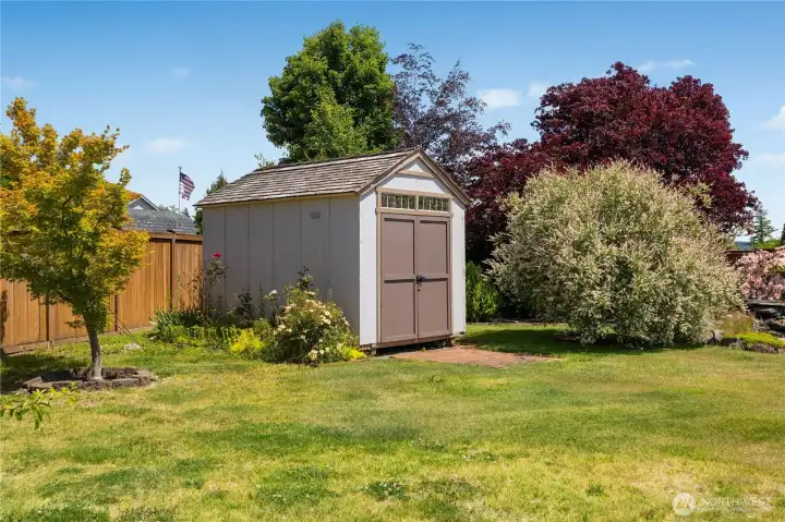 Out building offers additional storage for your outdoor equipment and toys.