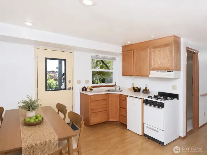 Downstairs kitchen and eating area - virtually staged Downstairs kitchen and eating area - virtually staged
