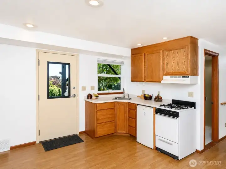 Downstairs kitchen with it's own exterior entry door. Downstairs kitchen with it's own exterior entry door.