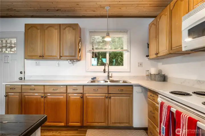 Updated Counters and back splash.  Light and Bright and easy to clean.