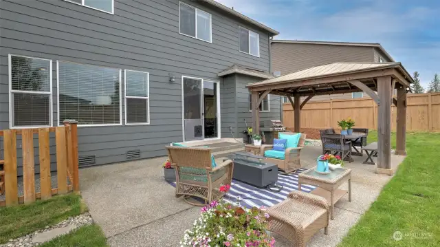 Generous patio area features a wonderful pergola for shade and entertaining.