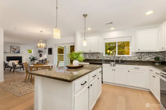 Kitchen opens into informal dining area.