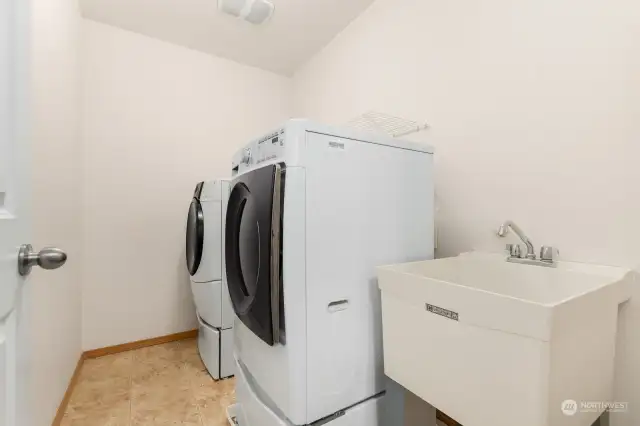 Laundry room with tub basin on the second floor.