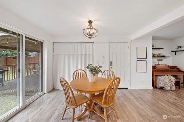 Dining area.  Washer and dryer are located behind the curtain