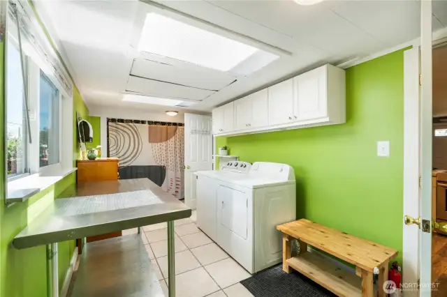 Large laundry room with pantry area