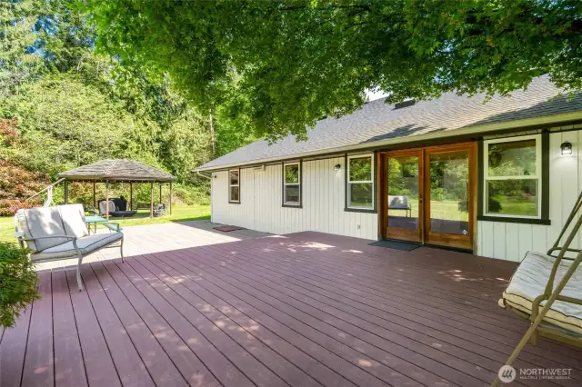 Come under the shade of this lovely maple and relax. Entertain a group on the deck, patio and gazebo with custom fire  pit.