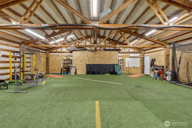 Loft area above shop is 36' x 40' and is currently used as an all season softball practice studio. Mini split by entrance door. Home office space? DADU possibly?