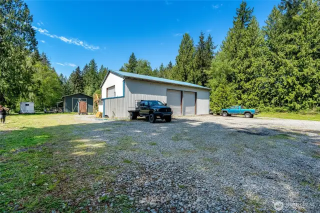 Shop, 20' x 20' green hay barn, 3 stall loafing shed behind hay barn.