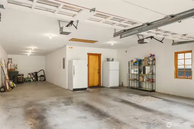 Spacious three car garage with option for boat parking & shop space.