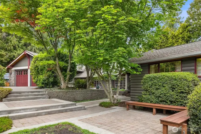 Front patio surrounded by luscious greenery.
