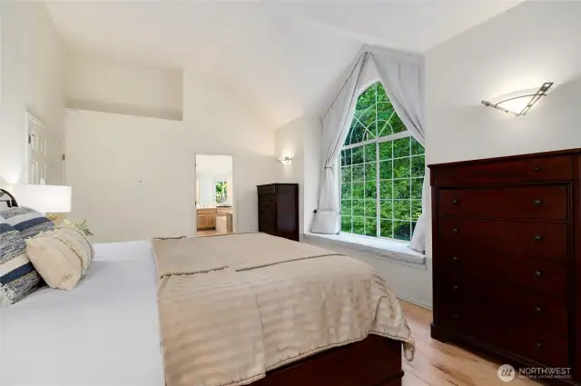 Another look at the elegant primary suite with direct access to a spacious en-suite bath.