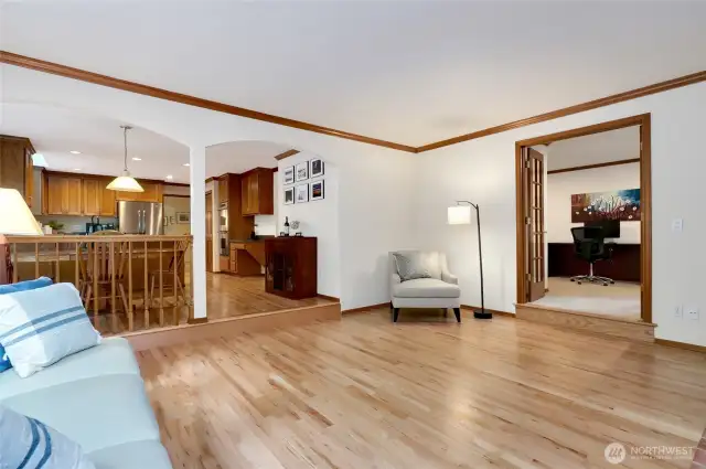 Open-concept layout seamlessly connects the kitchen and living areas, while French doors lead to a dedicated home office—ideal for remote work or study. Tasteful trim add timeless appeal throughout.