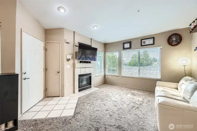 Livingroom is bright and airy with vaulted ceilings