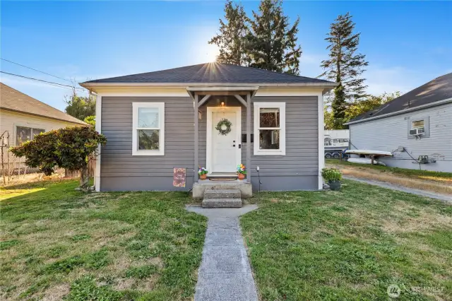 View from the sidewalk to front entrance of home