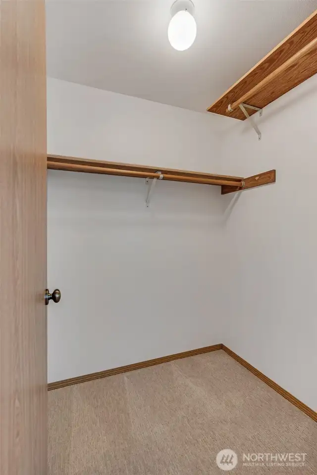 Walk-in closet for primary bedroom.