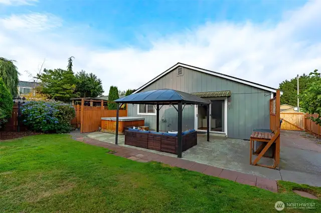 Outside, entertain under the pergola-covered patio, soak in the hot tub, play on the play-set & let the dogs roam in the dedicated dog run.