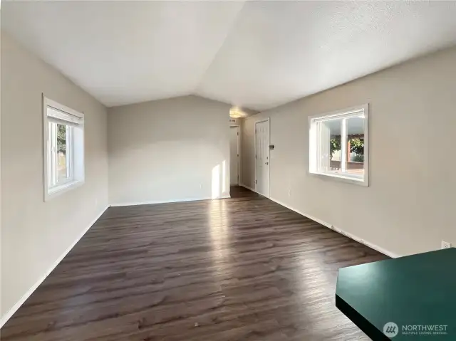 The home boasts vaulted ceilings throughout.
