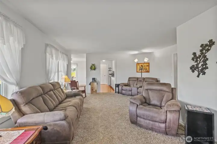 Living room looking into kitchen and dining