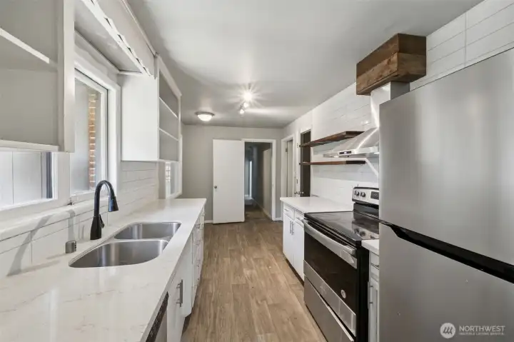 Galley style kitchen on the main. Lots of cabinets and a walk in pantry.