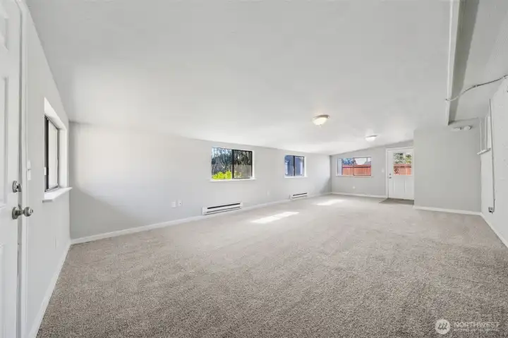 HUGE family room with 2 separate entrances - one from the driveway and another from the backyard.