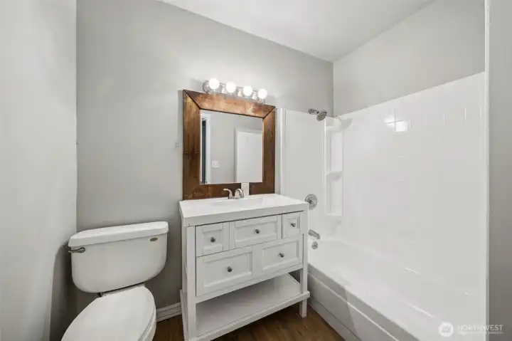 2nd bathroom on main level. Located outside bedrooms 3 and 4.