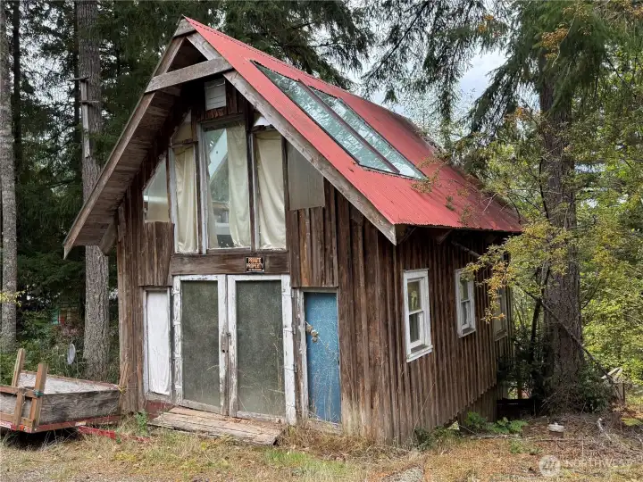 The detached "shop" is on the second parcel. In the tax records it is referred to as a garage...