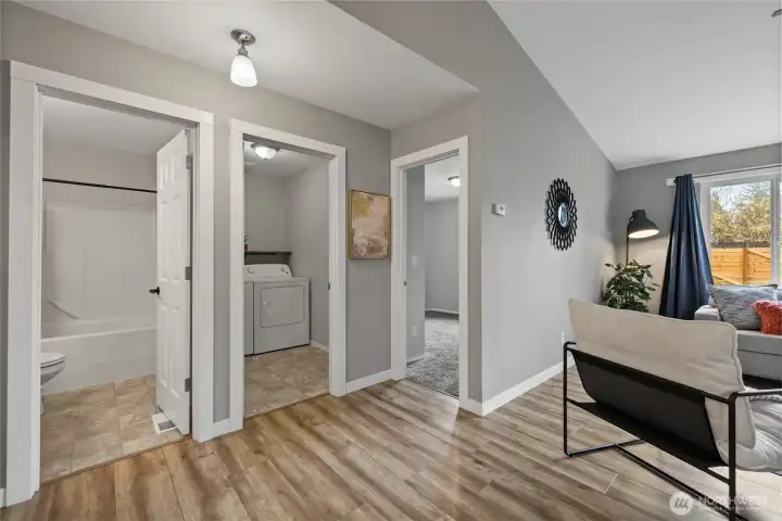 Laundry room is clustered with two bedrooms and a hall full bath - so convenient for cleaning up those messy situations