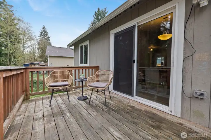Back deck is right outside the kitchen/dining room, convenient for grilling while watching the little ones play nearby