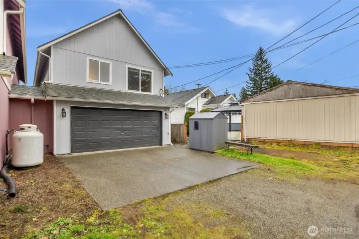 Spacious double garage off alley with extra space for shop or storage.