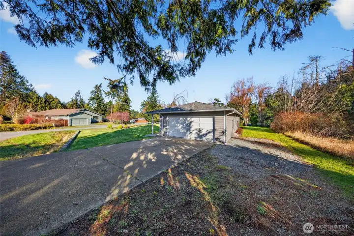 Spacious driveway and attached garage offer convenience and ample parking.