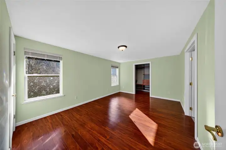 Generous primary suite offering privacy and relaxation.