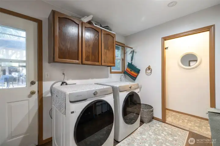 Utility room with pantry space. Newer washer and dryer stays with home!