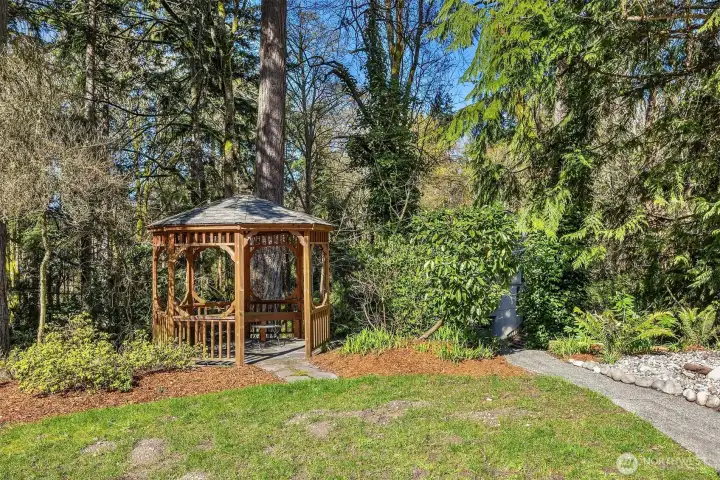 A serene outdoor sanctuary for enjoying a quiet afternoon, the expansive backyard serves as your personal retreat.