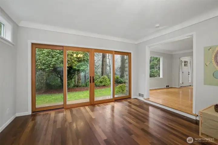 Large wall to wall slider door brings the outdoors in with a calming picturesque backdrop.