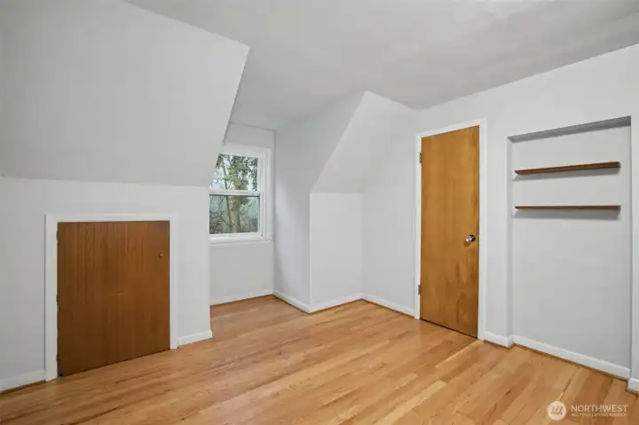 The upper-level bedrooms continue with hardwood floors and offer classic charm with coved ceilings and dormers adding usable space.