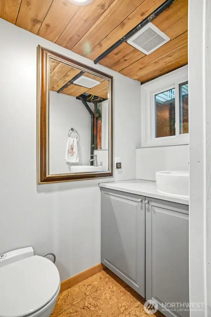 Half bath conveniently services the lower level.