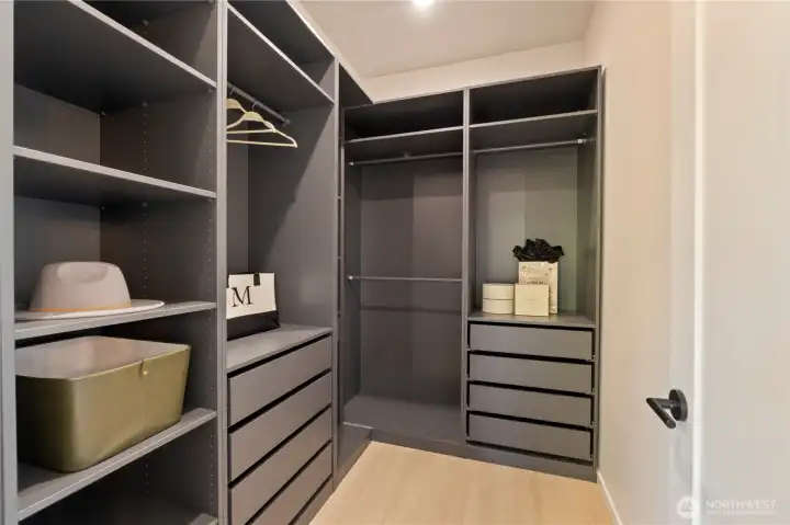 Primary bedroom walk in closet