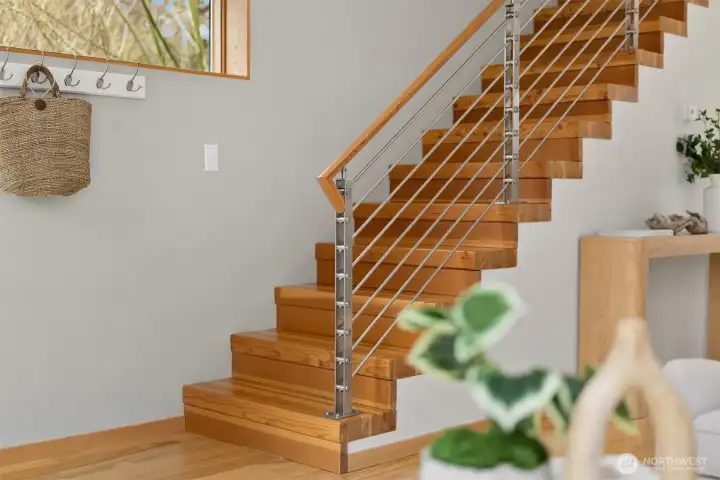 Stacked fir lumber on edge creates a striking and incredibly durable stairway to the upper level.